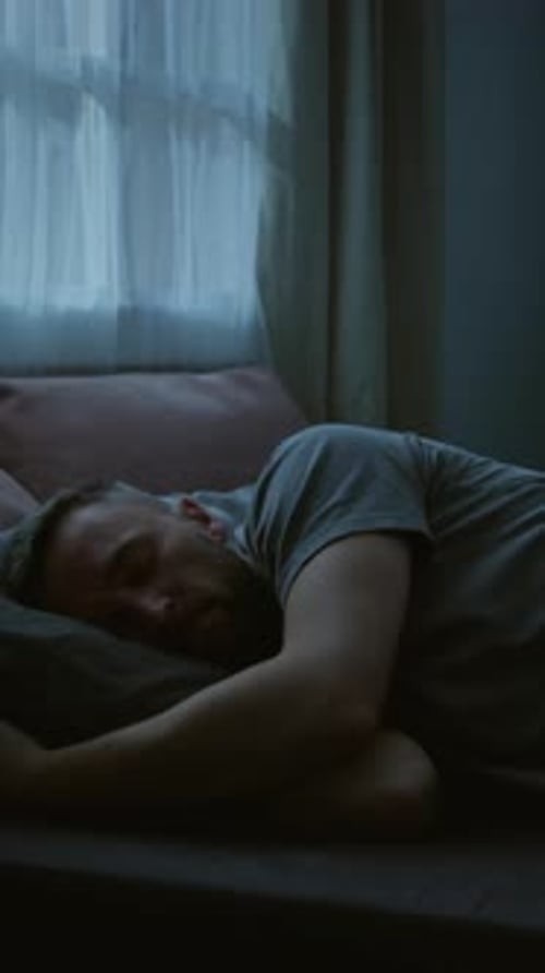 Vertical Time Lapse of Young Man with PTSD Turning in Bed All Night