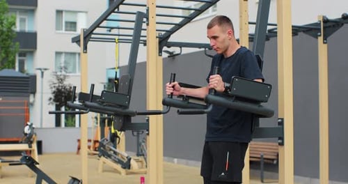 Man Working Out on Outdoor Exercise Machine