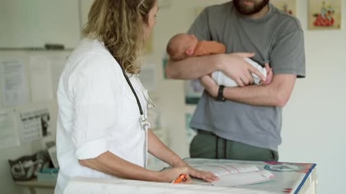 Doctor, baby dad and woman writing in hospital for healthcare service, check up or wellness