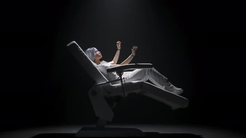 Woman Interacting with VR in Futuristic Chair
