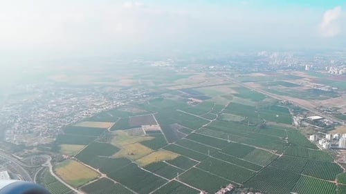 Airplane flying above the city, israel