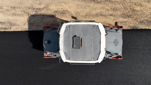 Road roller pressing fresh put Asphalt on a new road