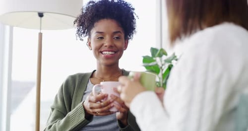 Two Women Chatting at Home with Tea