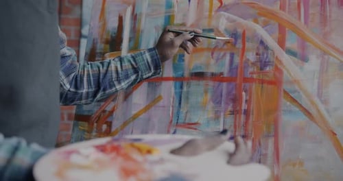 Artist Painting on Canvas in an Art Studio