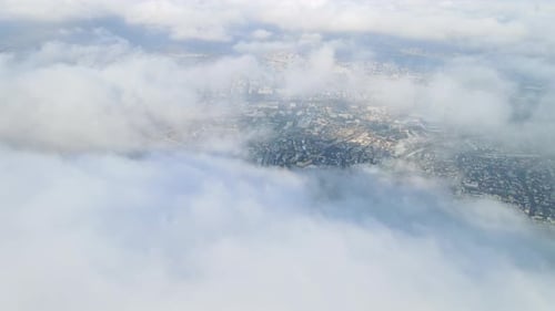 Aerial Drone View of Beautiful Cinematic White Large Clouds Moving Above City Plane Flight Natural