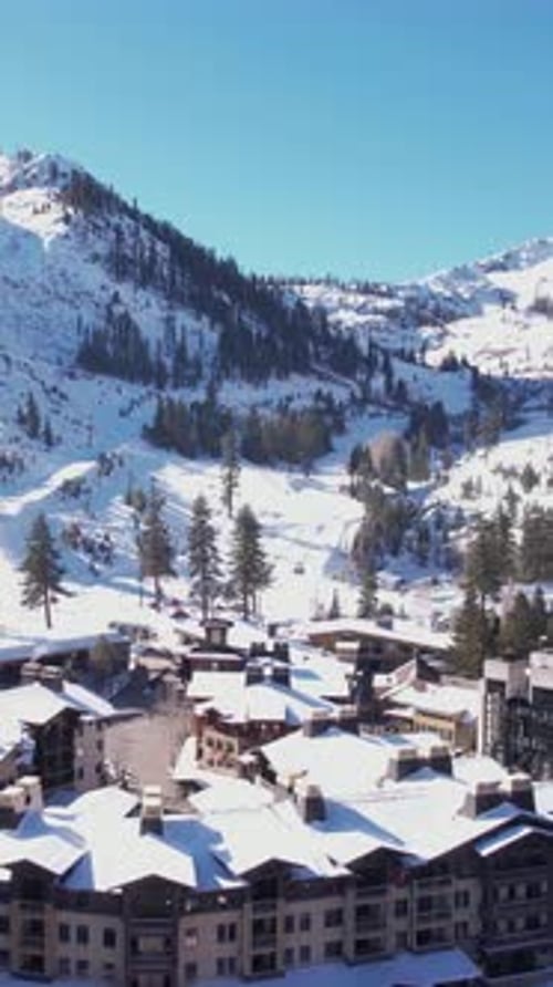 Vertical Aerial View of Lake Tahoe Ski Resort on Sunny Winter Day, Snow Capped Palisades