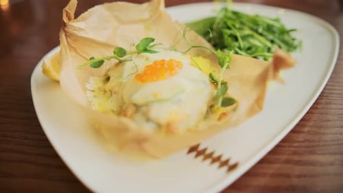 Elegant Plated Fish Dish with Salad and Lemon