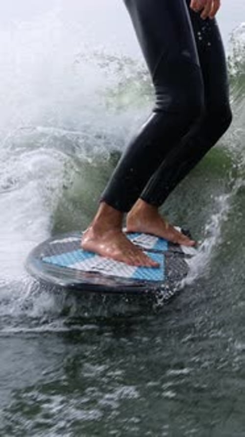 A Dynamic Surfing Experience Captured The Intricate Balance of Skill and Nature on Water with Feet