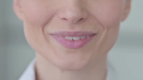 Close Up of Smiling Female Lips