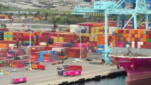 Container Ship in Import and Export Logistic Business Cranes in Savannah Seaport Unloading Shipping