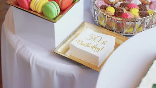 Elegant 50th Birthday Party Dessert Table Close-Up with and Sweets
