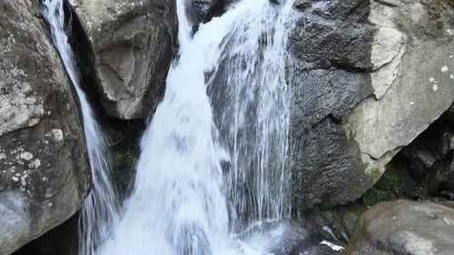 Small waterfall in middle of forest