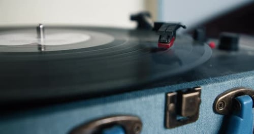 Close Up of Vinyl Record Playing on Turntable