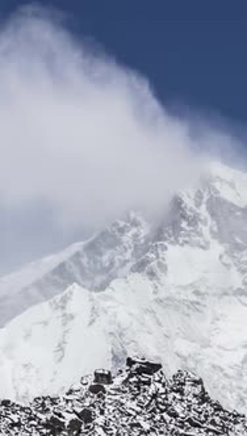 Time Lapse of Cho Oyu Peak Blue Sky with Clouds Himalayan Mountains Nepal Vertical Video