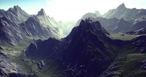 Majestic Mountain Peaks Rise Dramatically Under a Bright Morning Sun