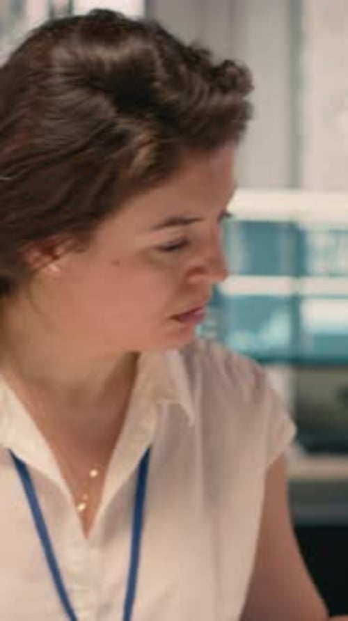 Vertical Video Female Worker Documenting Essential Ideas and Writing on Notebook