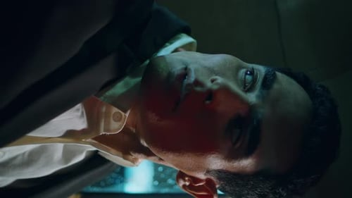 Contemplative Young Adult Man Inside Car at Night