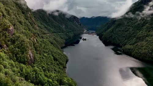 Majestic Fjord Captured in Norway Showcasing Serene Waters and Lush Mountains