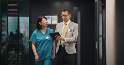 Nurse, person and walking with tablet in hospital for health management or staff service delivery