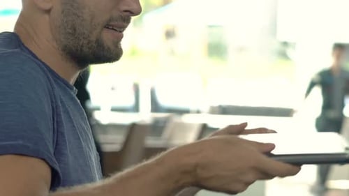 Young Man Finish Working on Laptop and Drinking Coffee in Cafe 30s