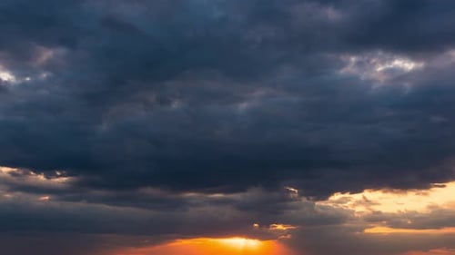 Dramatic Time Lapse of Storm Clouds at Sunset