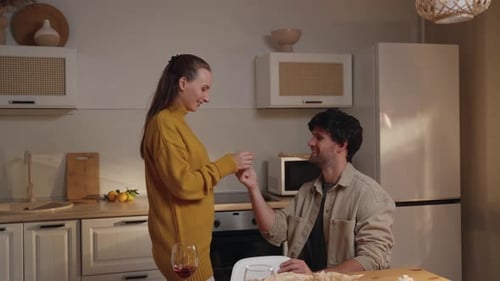 Young Couple Gets Engaged in a Kitchen