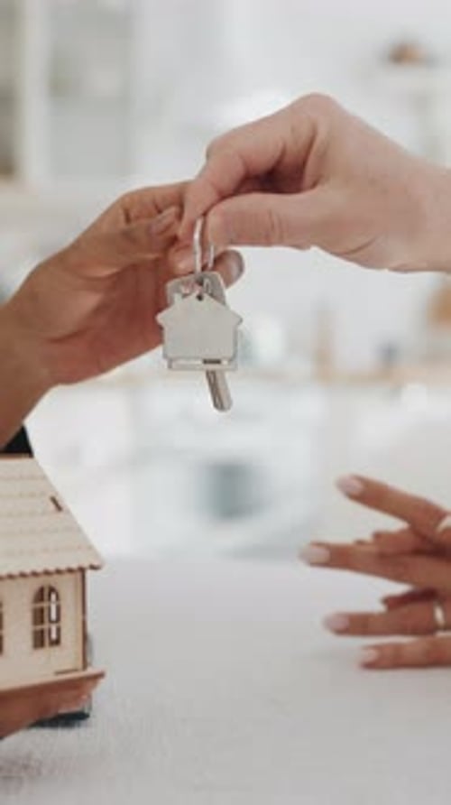 Hand Over Keys of New Living House From Real Estate Broker to Buyers Seller Giving Keys to New