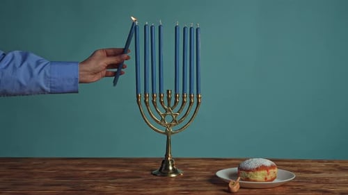 Illuminating the Spirit of Hanukkah With a Menorah and Sufganiyah