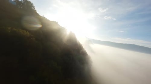 Majestic Aerial View of Misty Mountain Landscape at Sunrise
