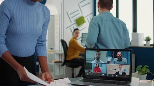 Young adult on video call in modern office