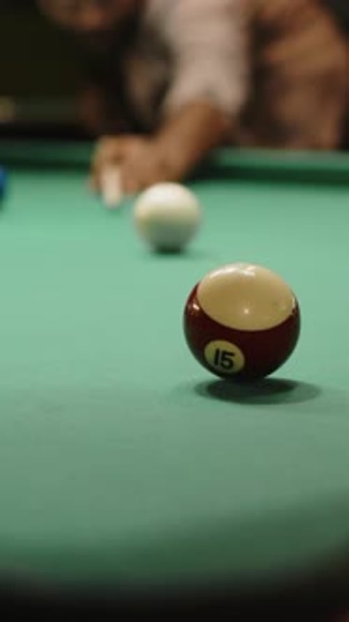 Vertical of Anonymous Billiard Player Failing to Sink Ball in Hole