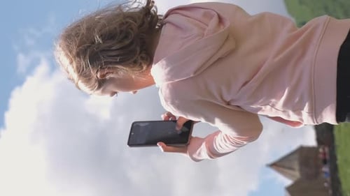 Little Girl Taking Photos of Old Church