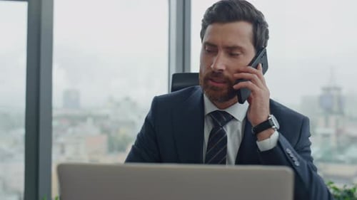 Angry Worried Businessman Calling Phone Sitting Luxury Office at Work Desk Closeup