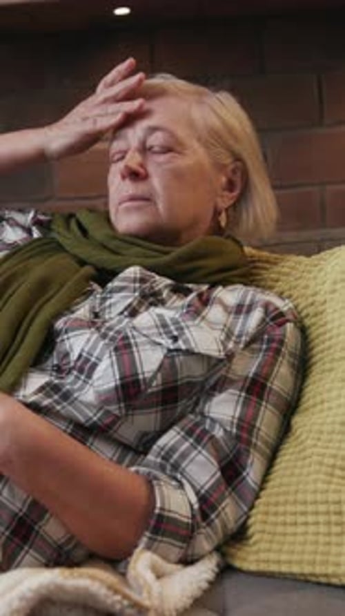A Thoughtful Senior Woman in a Cozy and Comfortable Setting Engaged in Reflective Contemplation
