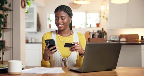 Young Woman Shops Online at Home with Laptop