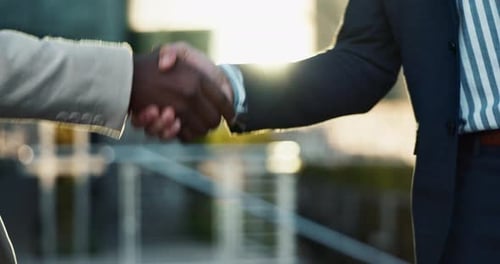 Business people, shaking hands and city meeting for b2b partnership, outdoor deal