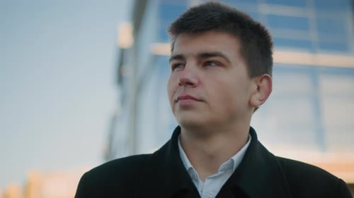 Thoughtful Young Adult in City Close Up