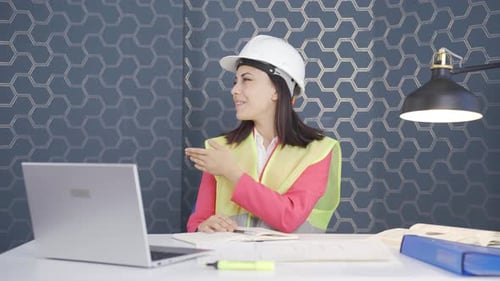 Woman engineer presents project.
