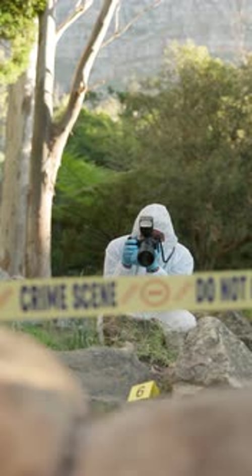 Investigator Taking Photos at Crime Scene