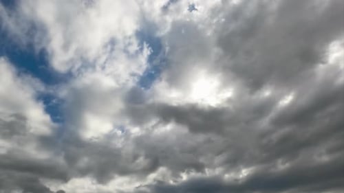 Heavy dark clouds gathering in the skies. Cloudscape quick formation timelapse. Low angle view.