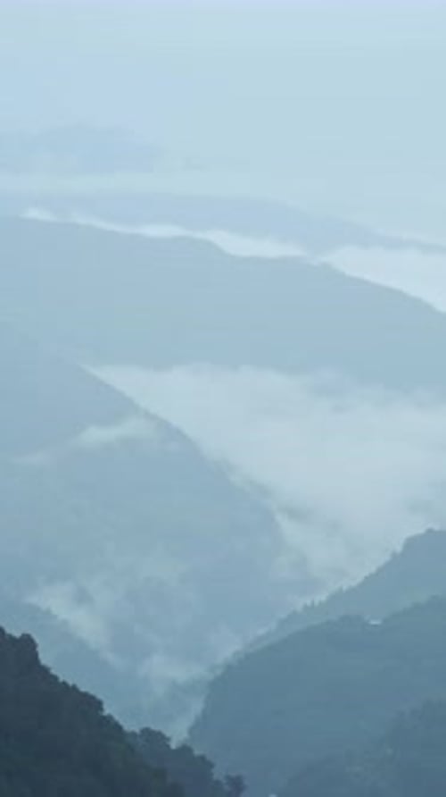 Low Clouds Layers in a Mountain Valley, Vertical Mountains Video for Social Media Instagram Reels an
