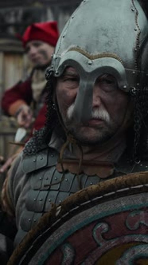 Portrait of Grim Military Commander with Sword and Shield Guarding Castle