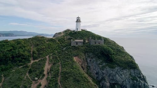 Aerial View of an Old Lighthouse on the Cliff on Pacific Coast Beautiful Panoramic Seascape