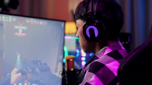 Asian Boy Streamer Celebrating Winning Game On Computer. Live Stream Video Game