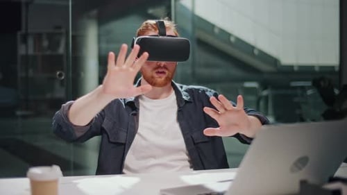 Futuristic Workflow Man Uses 3D Augmented Reality Glasses in Modern Office