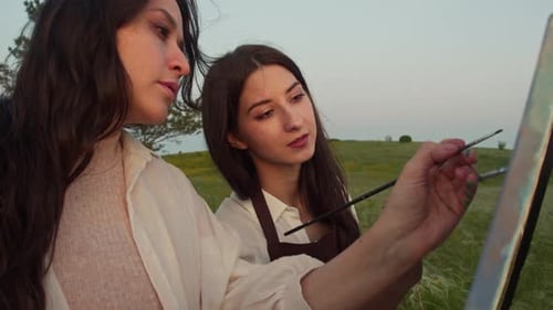 Two Friends Like to Paint Pictures in the Country They Talk to Each Other and Smile They Enjoy