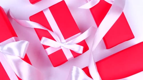 Red Gift Boxes with White Ribbons on White