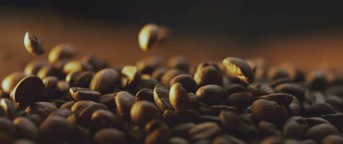 Falling roasted coffee beans