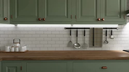 Modern kitchen interior with green cabinets