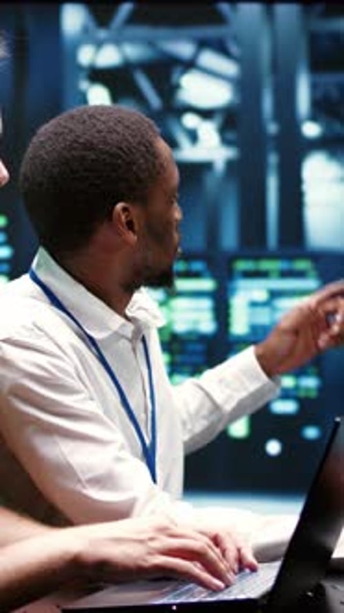 Vertical Video Coworkers Running Data Center Tests